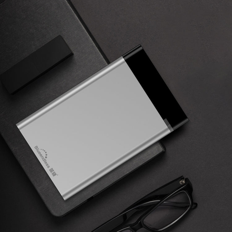 a black and white device next to a black object