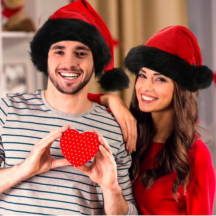 a man and woman wearing santa hats