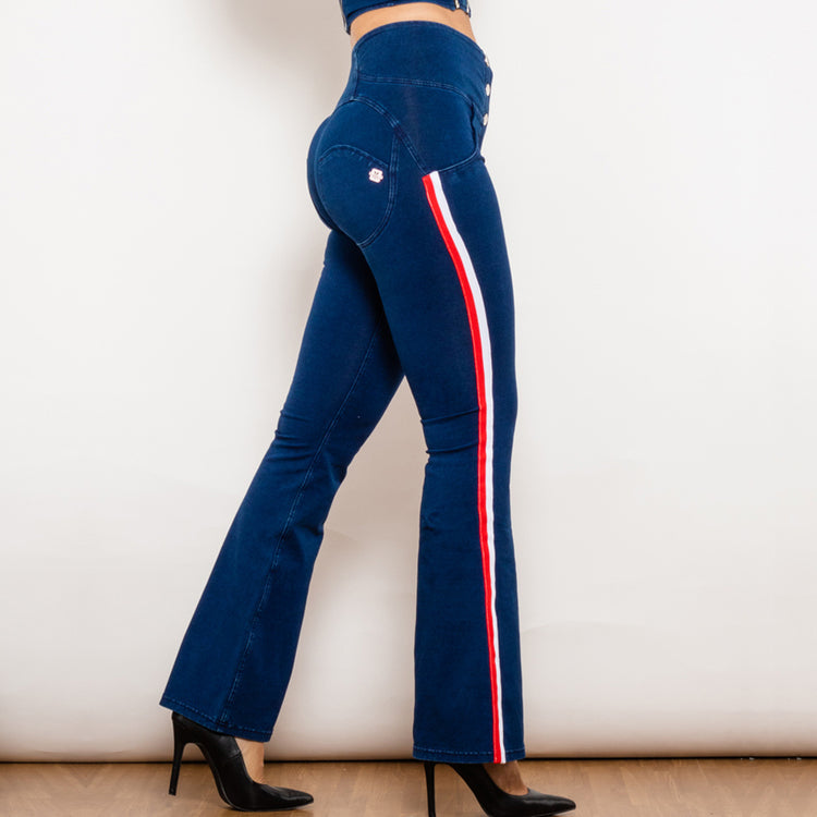 a woman wearing blue jeans and high heels