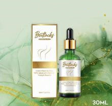 a bottle of oil with a dropper