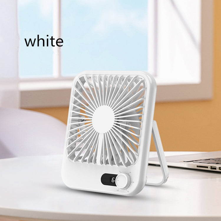 a small white fan on a table