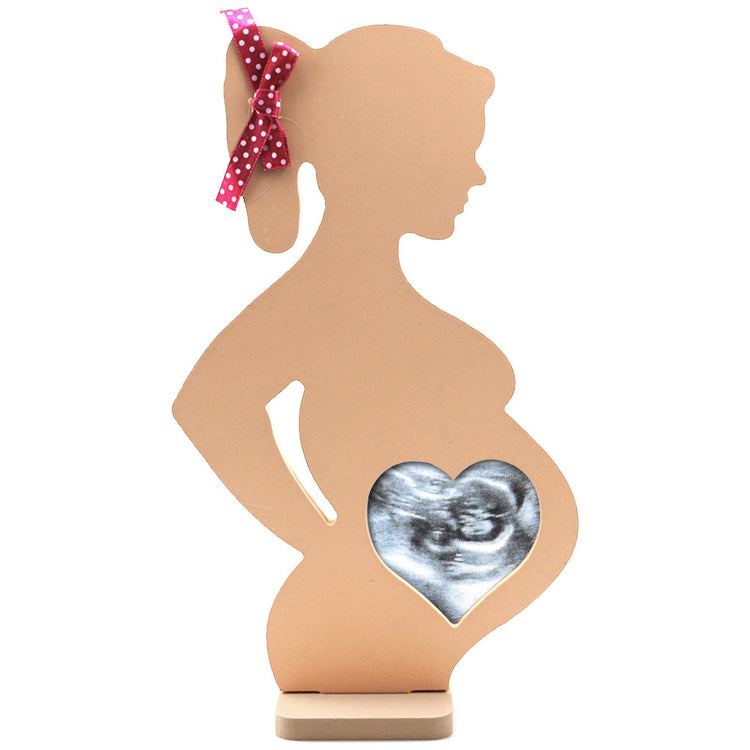 a pregnant woman with a heart and ultrasound picture