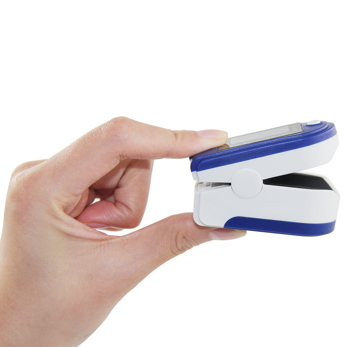a hand holding a pulse oximeter