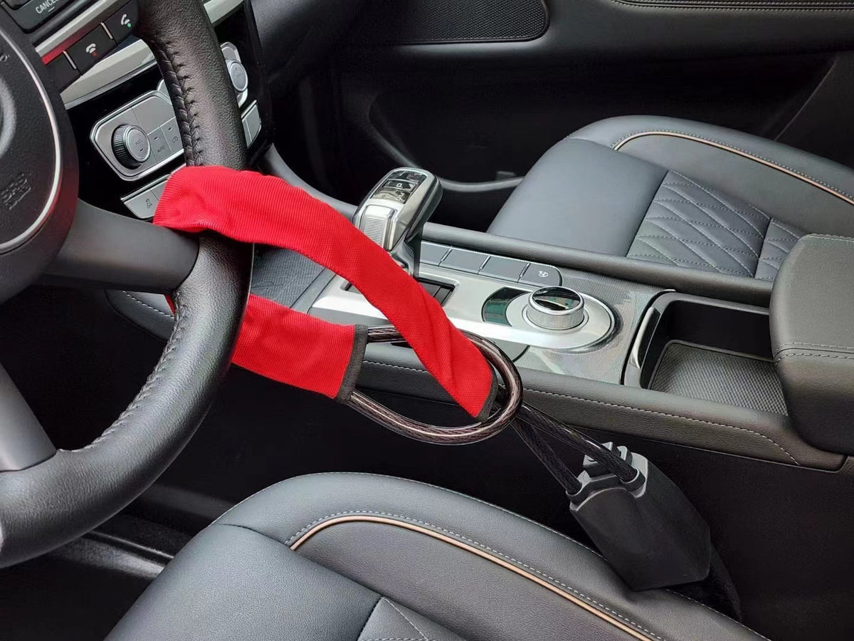 a red strap on a steering wheel