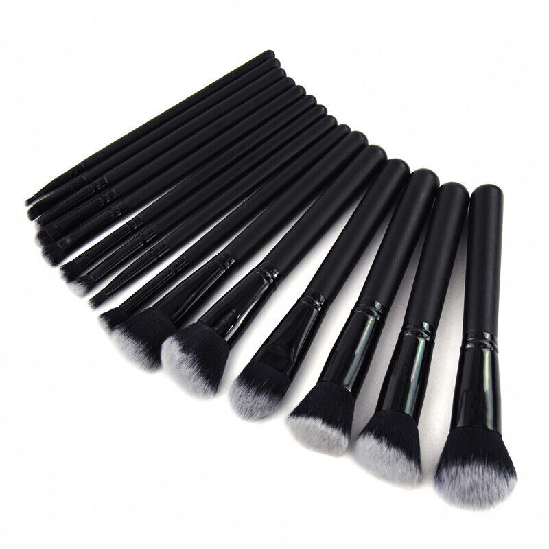 a group of black makeup brushes