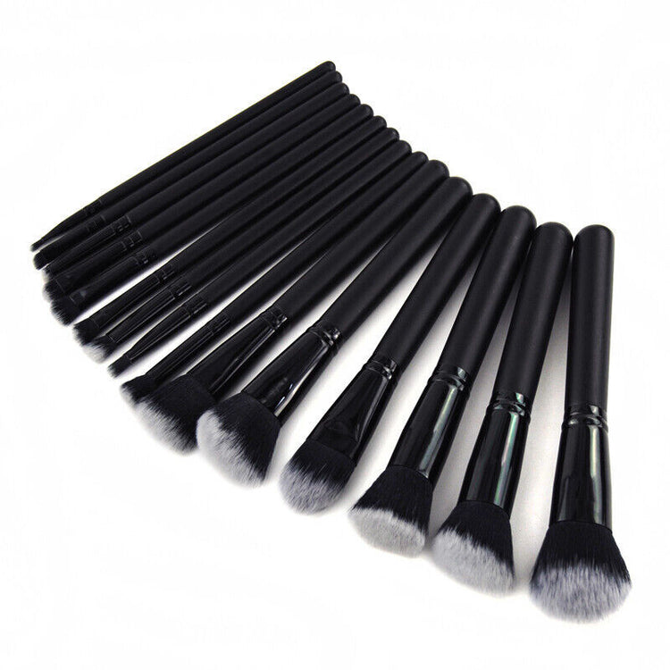 a group of black makeup brushes