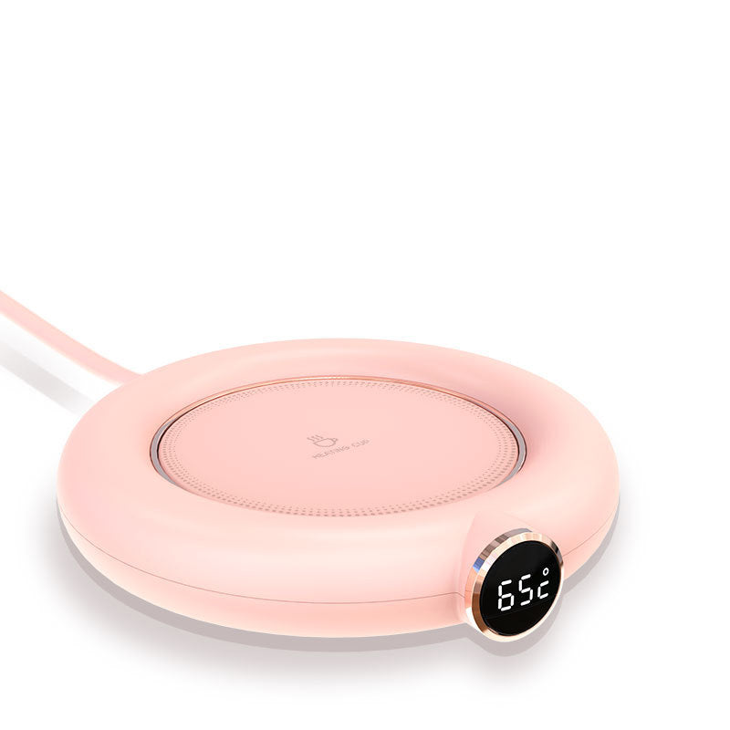 a pink circular device with a digital display