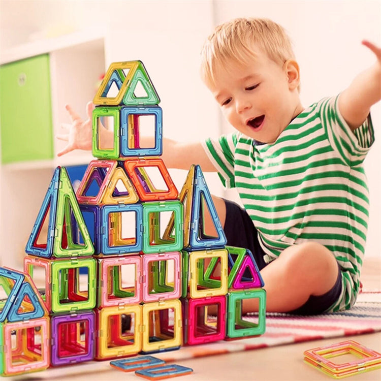 a child playing with colorful magnet blocks