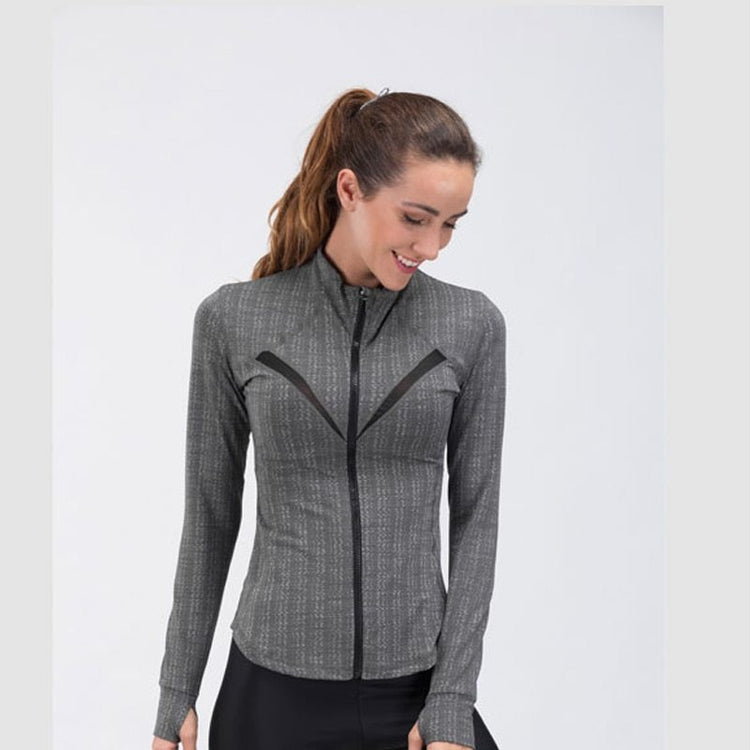 a woman in a grey jacket