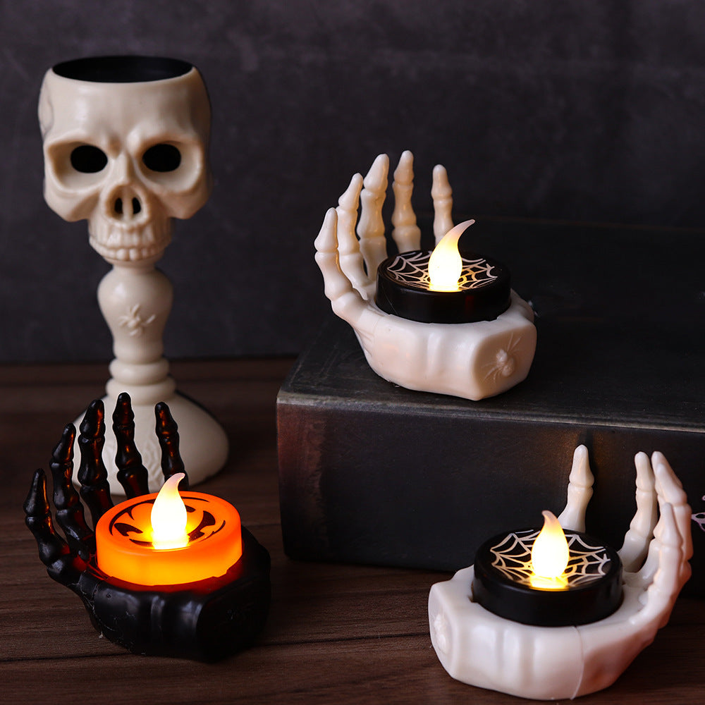 a skull and candles on a table