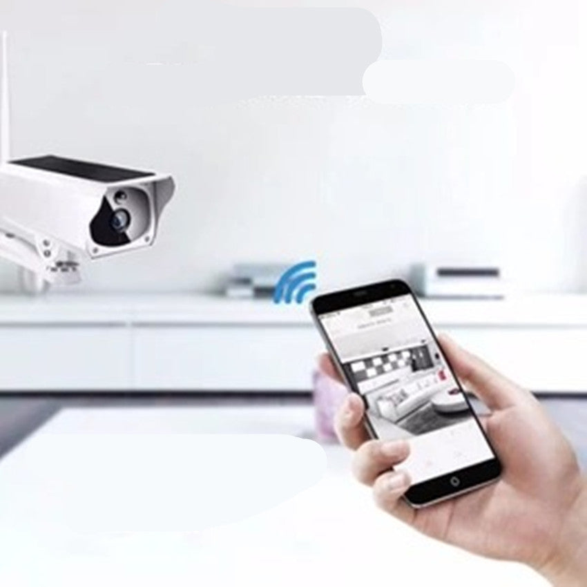 a hand holding a phone and a camera