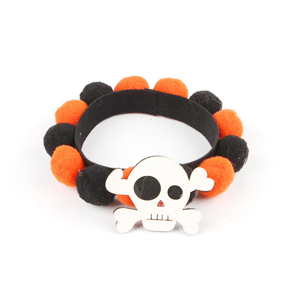 a black and orange hair band with a skull and crossbones