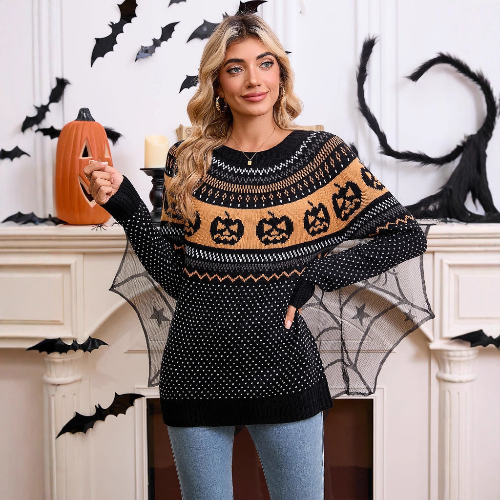 a woman wearing a sweater with a spider web and a pumpkin