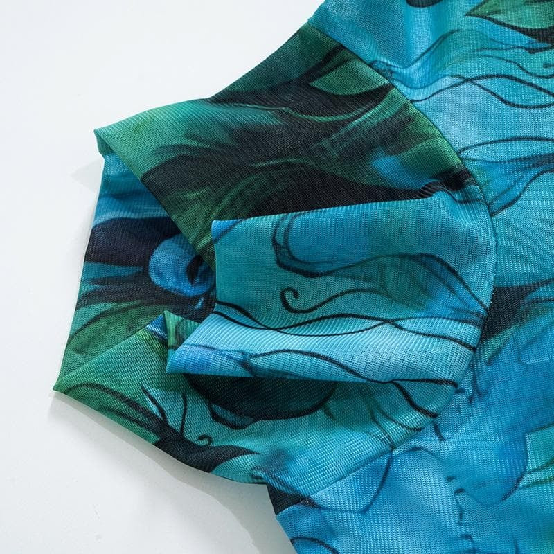 a blue fabric with black and green designs