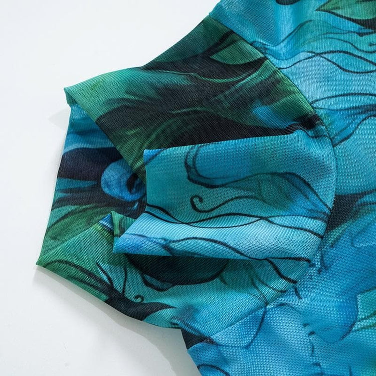 a blue fabric with black and green designs