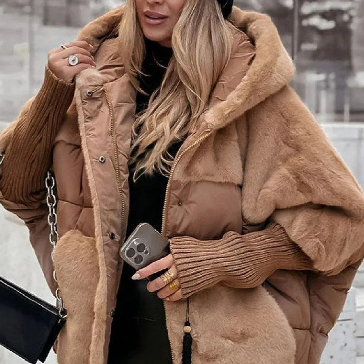 a woman in a hat and a fur coat