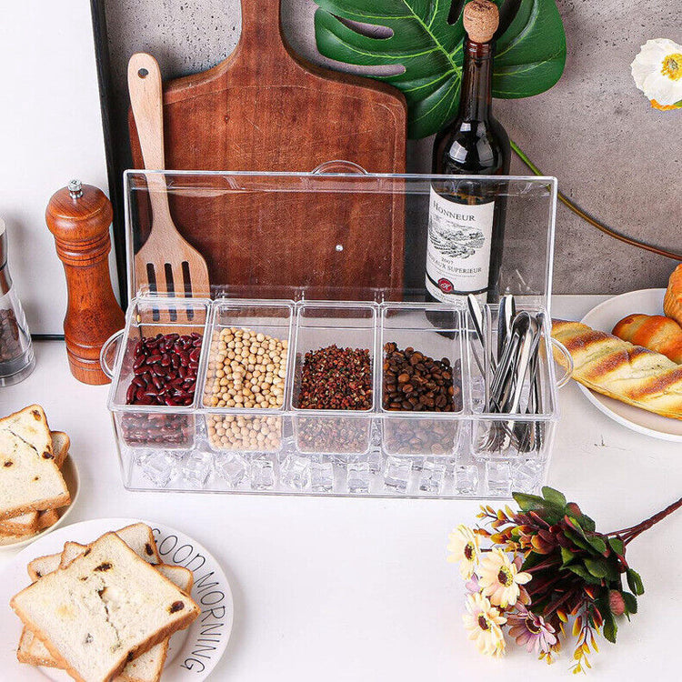 a container with food and utensils on a table