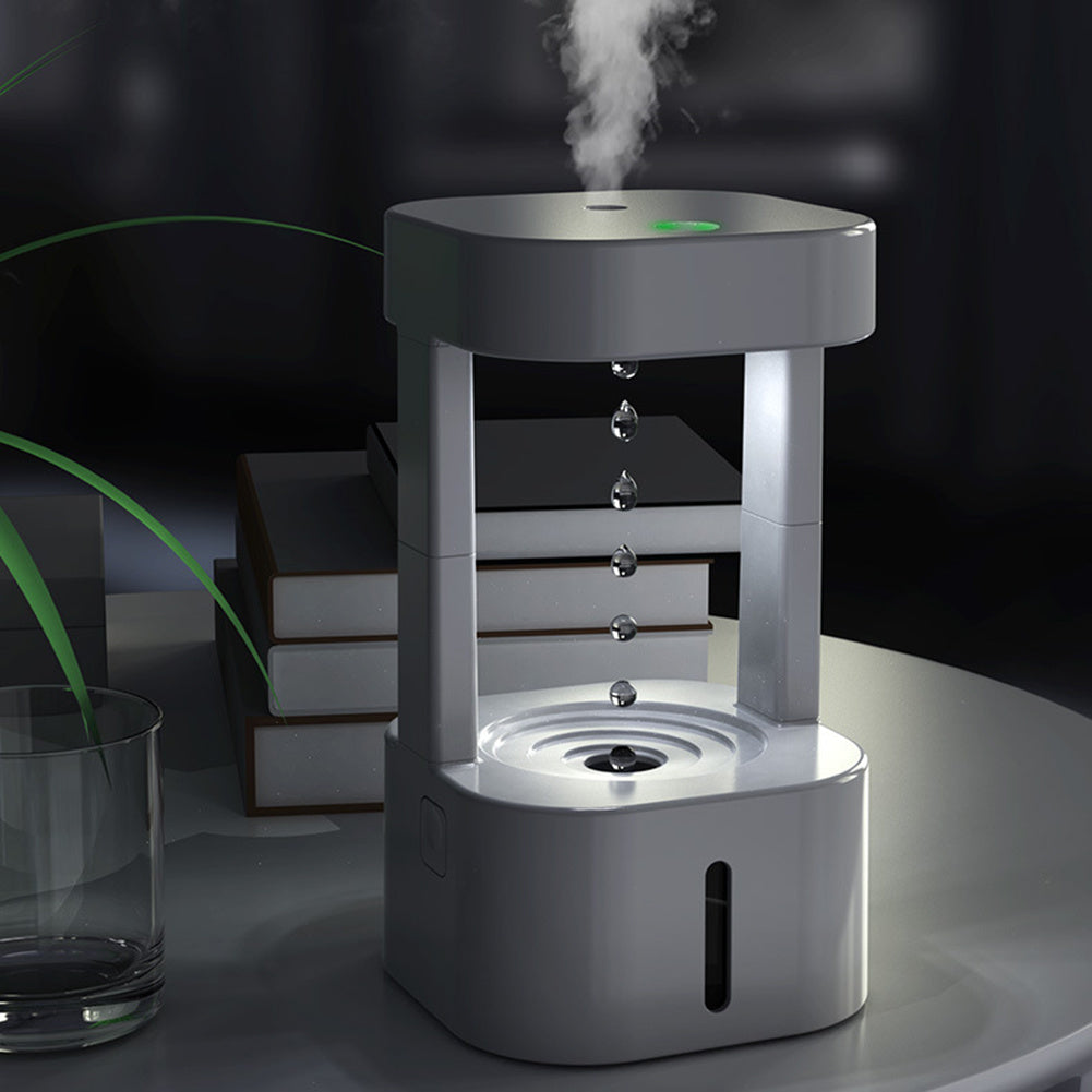 a white device with water droplets coming out of it