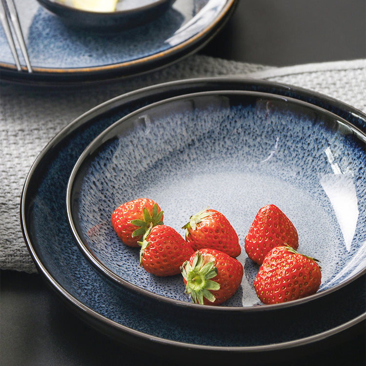 a bowl of strawberries on a plate