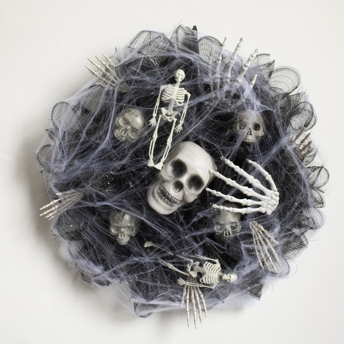 a group of skeletons in a spider web