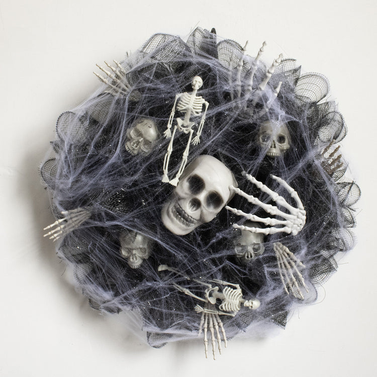 a group of skeletons in a spider web