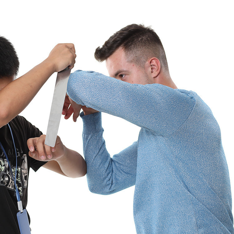 a man holding a knife to another man's hand