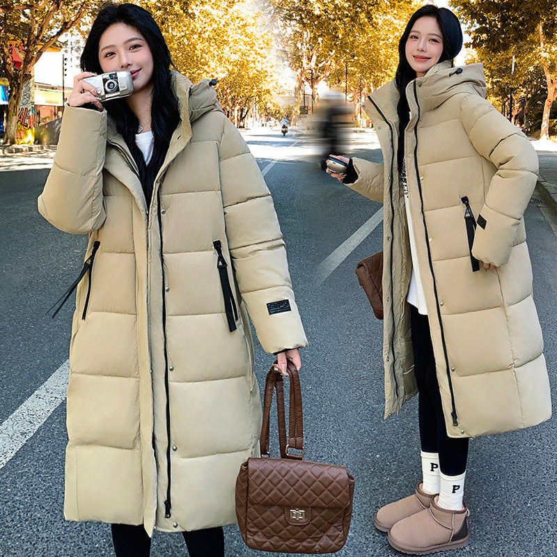 a woman in a long coat