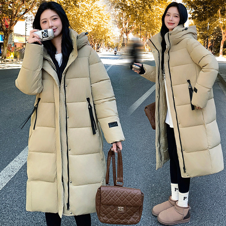 a woman in a long coat