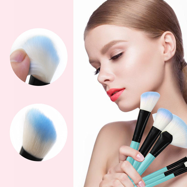 a woman holding a set of makeup brushes