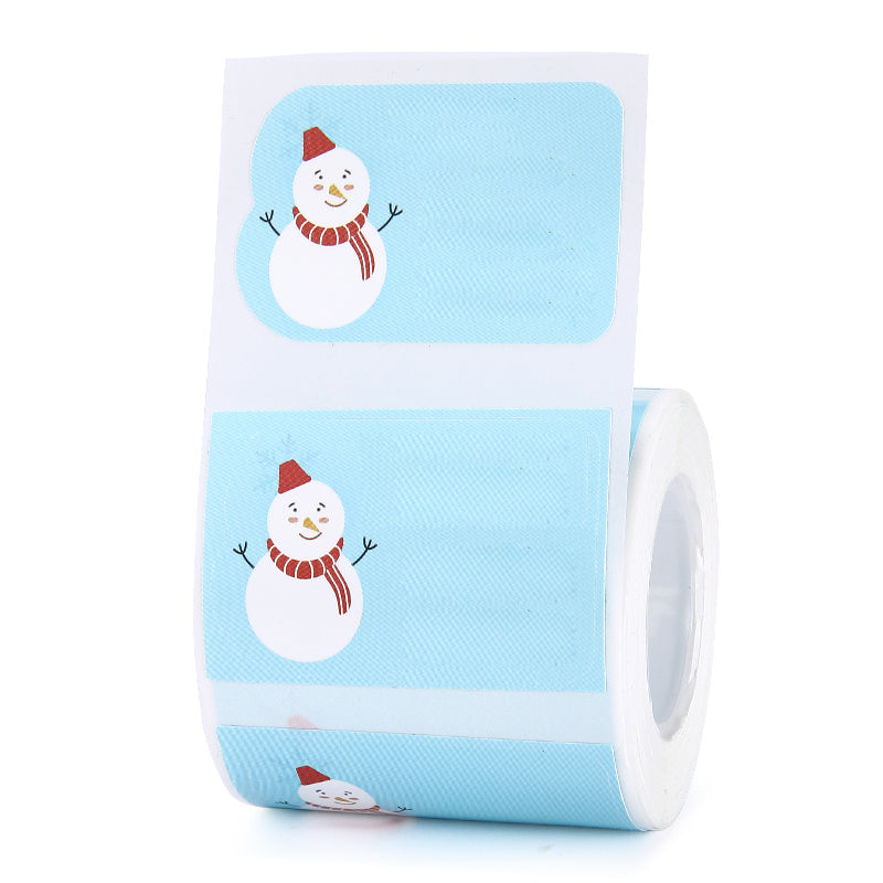 a roll of blue and white stickers with snowman images