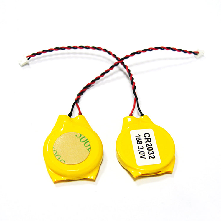 a pair of yellow batteries with black and red wires