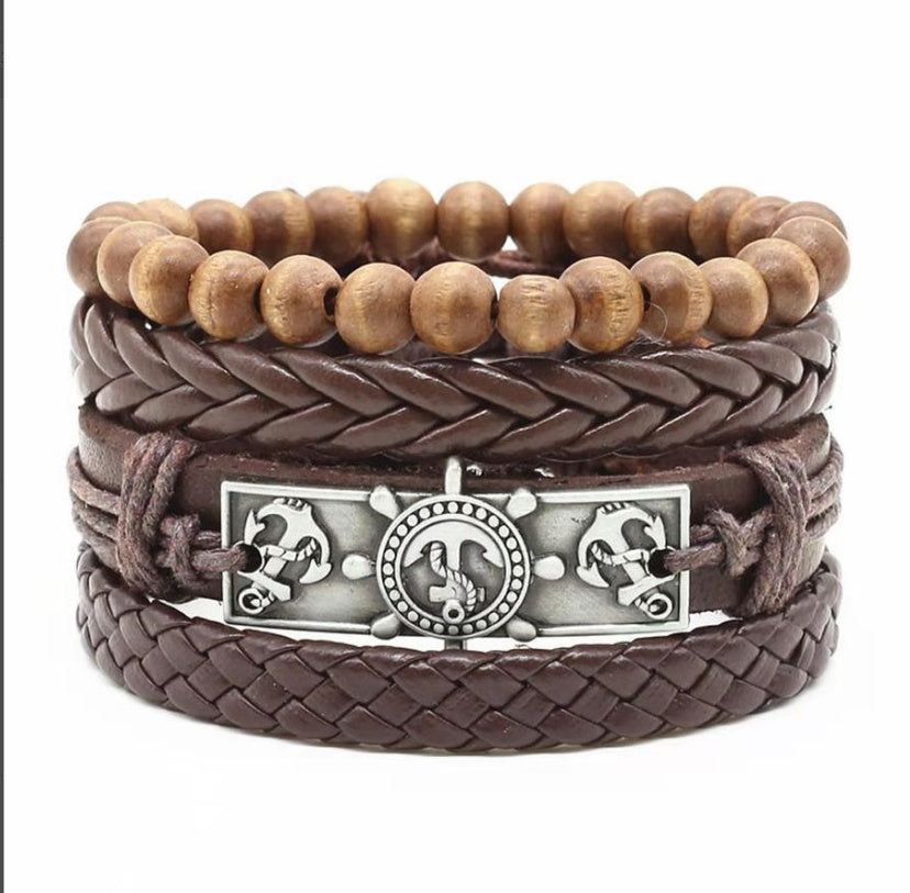 a brown leather bracelet with a metal buckle and wooden beads