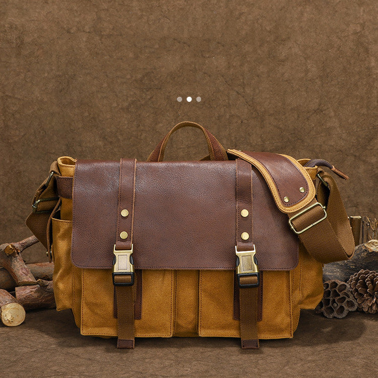 a brown and tan bag with a brown strap