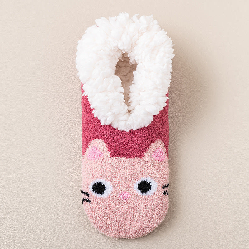 a pink and white fuzzy sock with a cat design