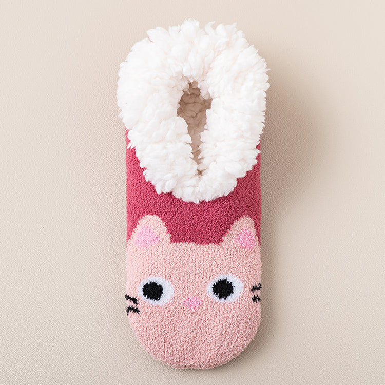 a pink and white fuzzy sock with a cat design