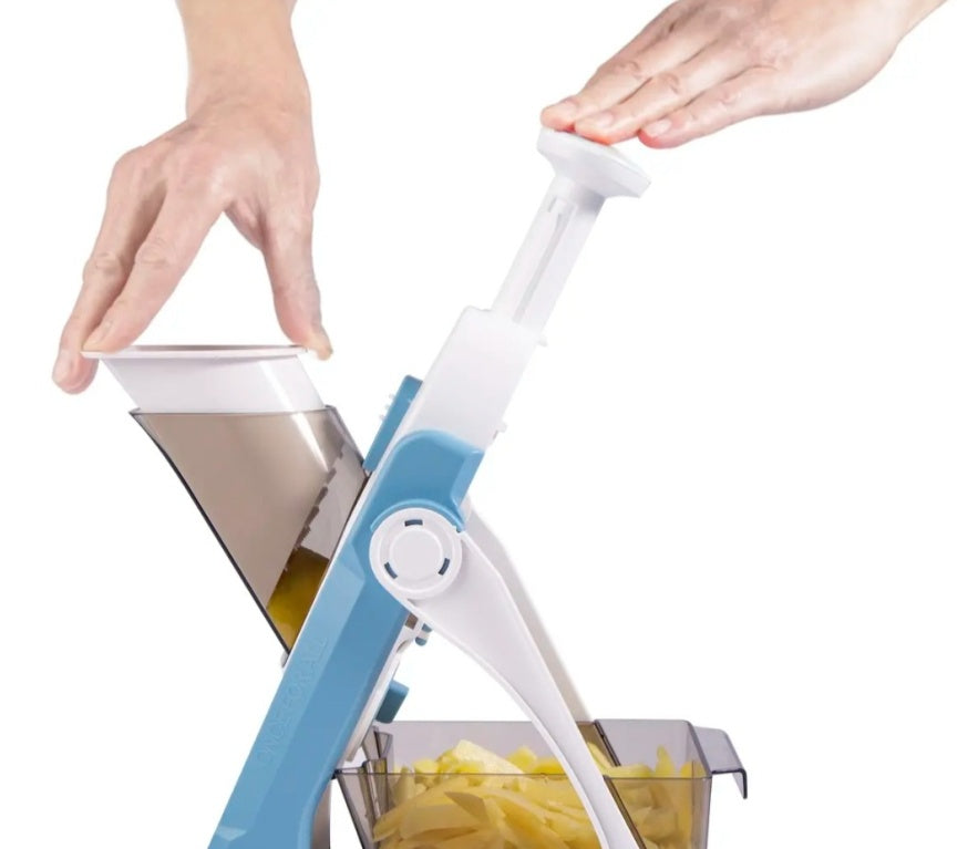 a person squeezing a potato wedge into a container