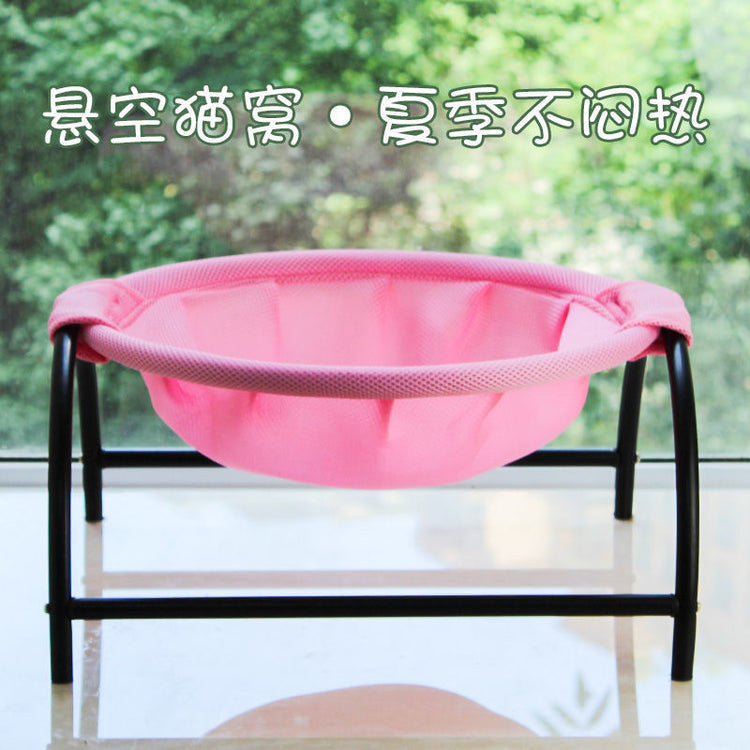 a pink baby hammock on a black frame