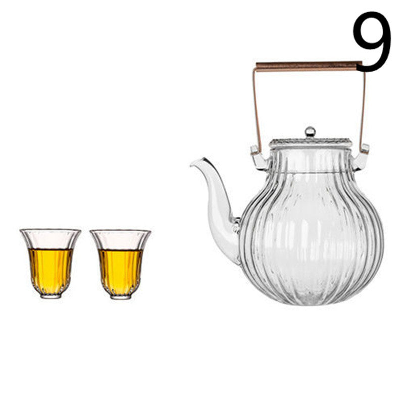 a glass teapot and two glasses