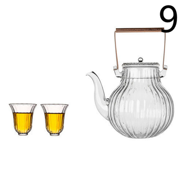 a glass teapot and two glasses
