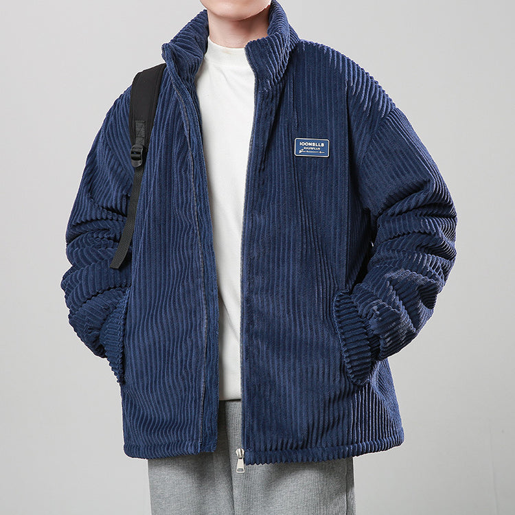 a boy in a blue jacket