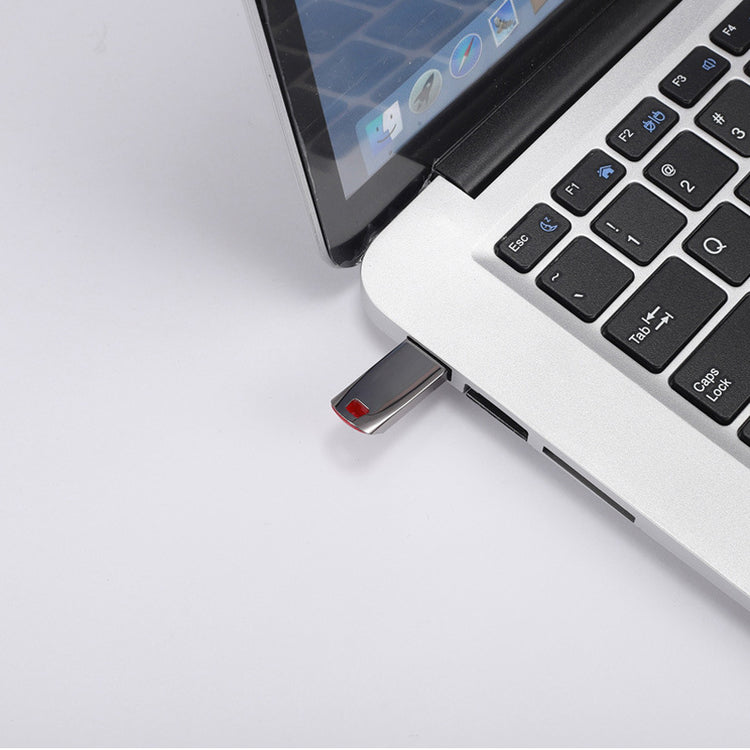 a usb flash drive plugged into a laptop