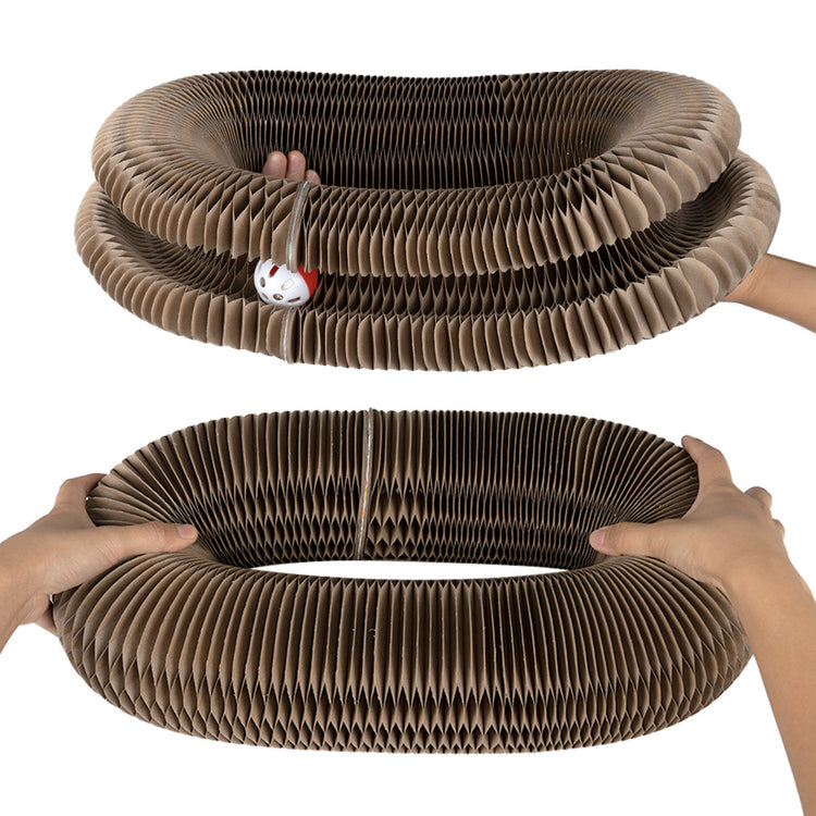a pair of hands holding a spiral shaped object