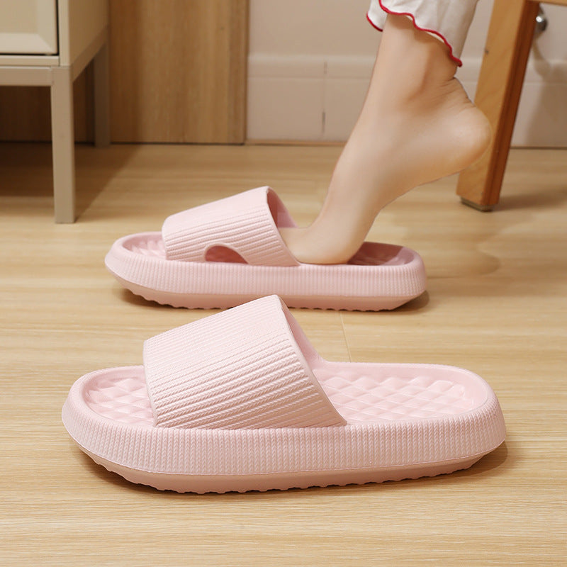 a person's foot in a pink slipper
