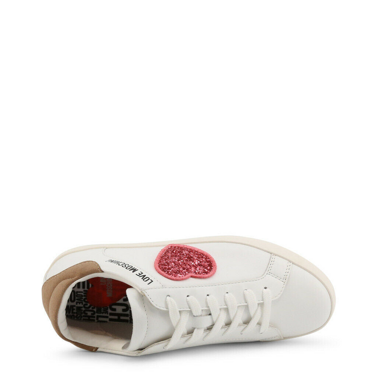 a white shoe with pink heart on it