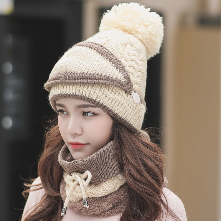 a woman wearing a hat and scarf