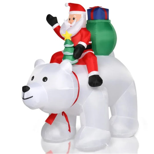 a inflatable santa claus riding a polar bear