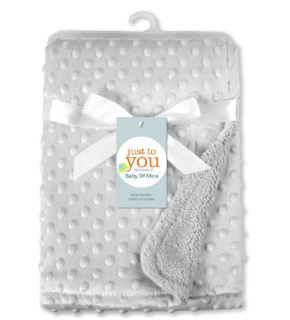 a blanket with a bow