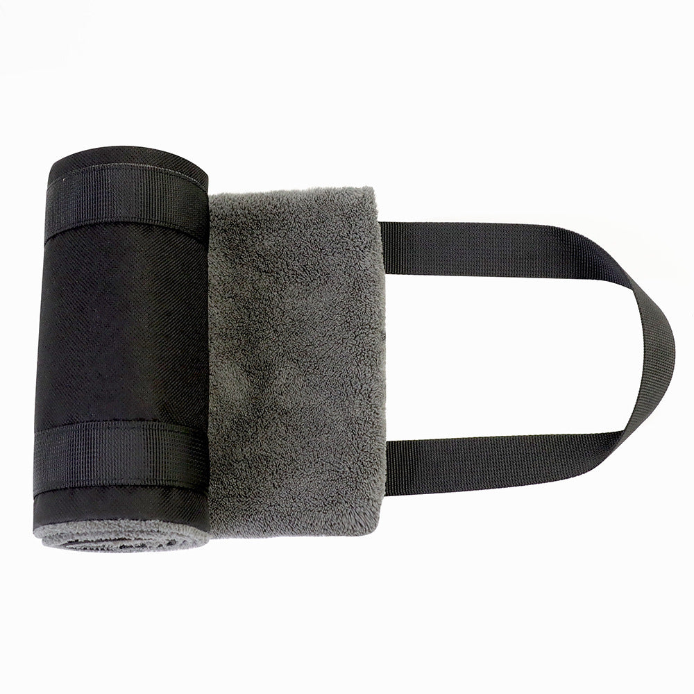 a black towel roll on a white background