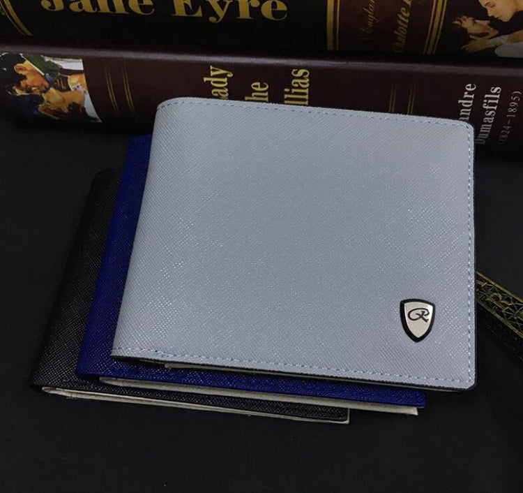 a wallet on top of a stack of books