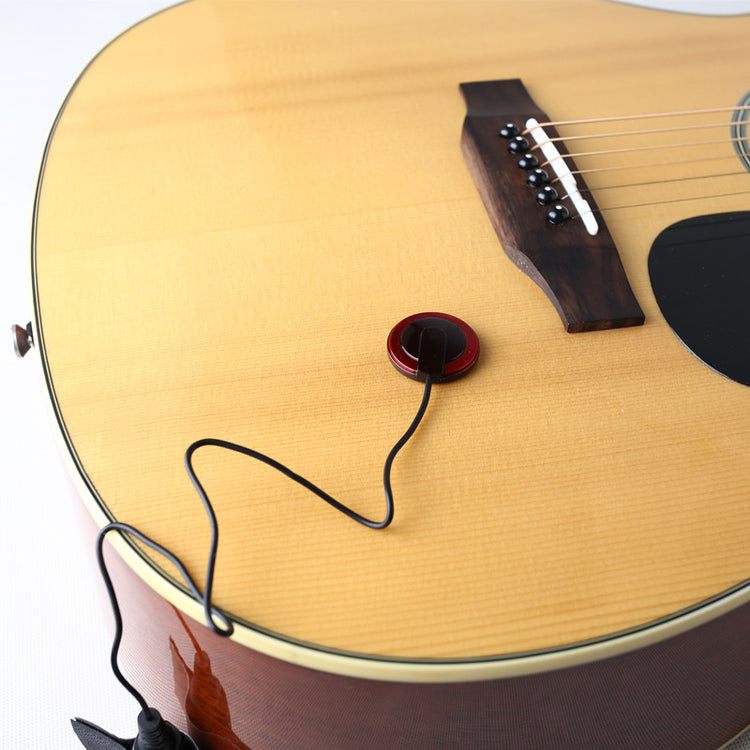 a guitar with a black cord